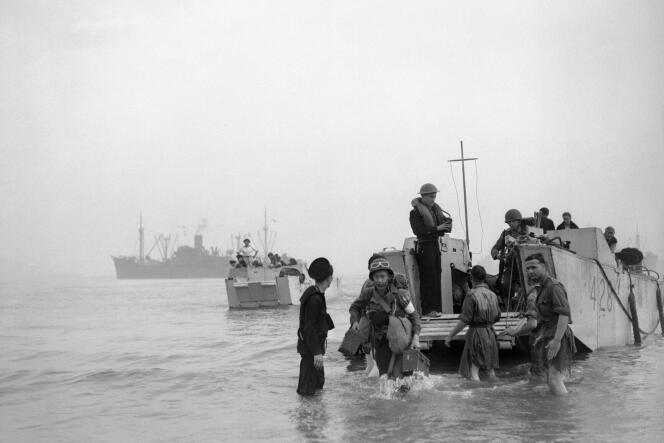 Troops and ammunition are brought ashore at Arzew, Algeria, during Operation Torch in November 1942