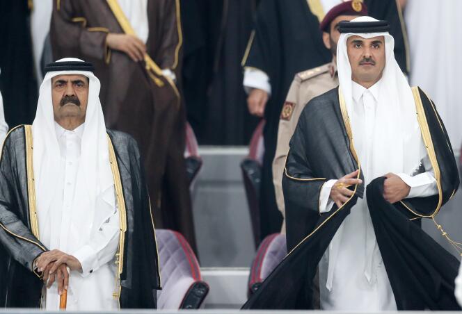 The Emir of Qatar, Tamim Bin Hamad Al Thani (right), and his father, Hamad Bin Khalifa Al Thani, in Doha in 2019. 
