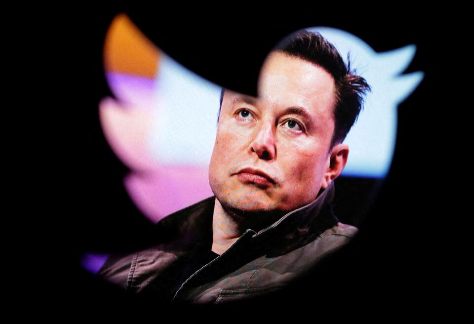 FILE PHOTO: Elon Musk's photo is seen through a Twitter logo in this illustration taken October 28, 2022. REUTERS/Dado Ruvic/Illustration/File Photo