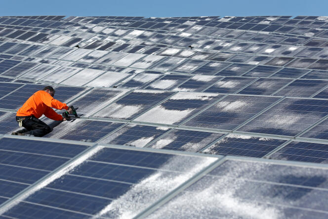 A maintenance worker working on solar panels at the Norsol solar energy company in Villaldemiro, northern Spain, in 2015.