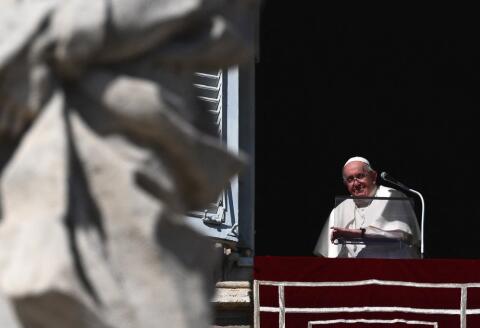 Pope Francis addresses the crowd during his Angelus prayer marking the All Saints' Day, from the window of the apostolic palace overlooking St. Peter's Square at the Vatican on November 1, 2022. (Photo by VINCENZO PINTO / AFP)