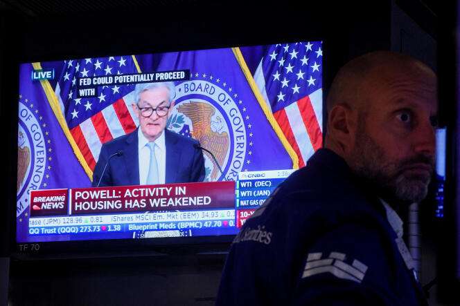 A trader reacted to US Federal Reserve Chair Jerome Powell's announced interest rates increase at the New York Stock Exchange on November 2, 2022.  