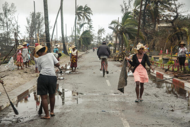 People employed by the FID (Intervention Fund for Development) clean up after cyclone Batsirai, in Tanambao district, Mananjary, Madagascar, February 8, 2022. 