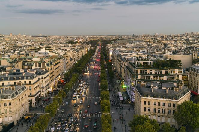 Streetview of famous Champs Elysees with illumination and traffic