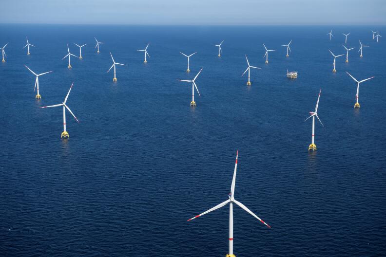 This aerial photograph taken on June 16, 2022, shows a general view of the Wikinger wind turbine farm in the Baltic Sea, north-east of Rugen Island in Germany. (Photo by FRED TANNEAU / AFP)