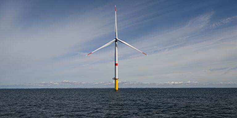 A wind turbine is pictured on the first French offshore wind farm off the coasts of La Turballe, western France on September 30, 2022. - The wind farm, consisting of 80 wind turbines, will supply 480MW, with an investment of 2 billion euros (Photo by Damien MEYER / AFP)