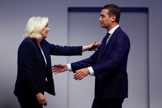 Jordan Bardella, newly-elected President of the French far-right Rassemblement National party, embraces Marine Le Pen after the results during the party's Congress in Paris, France, November 5, 2022. 