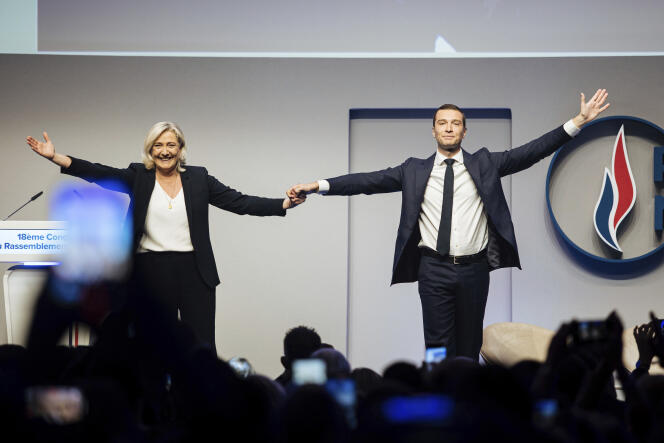French far-right leader Marine Le Pen celebrates with newly elected president of her Rassemblement National party Jordan Bardella, during the party congress in Paris, Saturday, November 5, 2022.