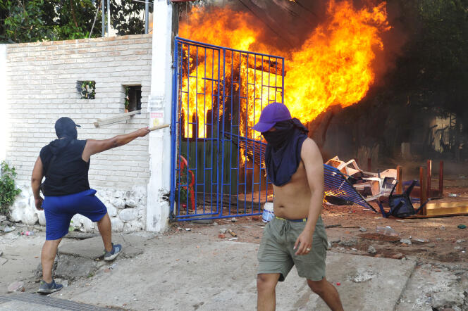 A fire ravages offices belonging to the Federation of Peasant Workers of Santa Cruz set on fire by demonstrators during a demonstration, November 11, 2022.