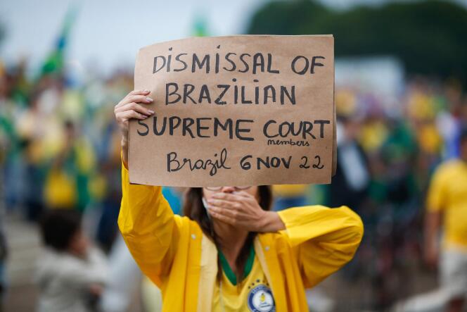 Supporters of Brazilian President Jair Bolsonaro take part in a demonstration against the results of the second round of elections in front of the army's headquarters in Brasilia on November 15, 2022. 