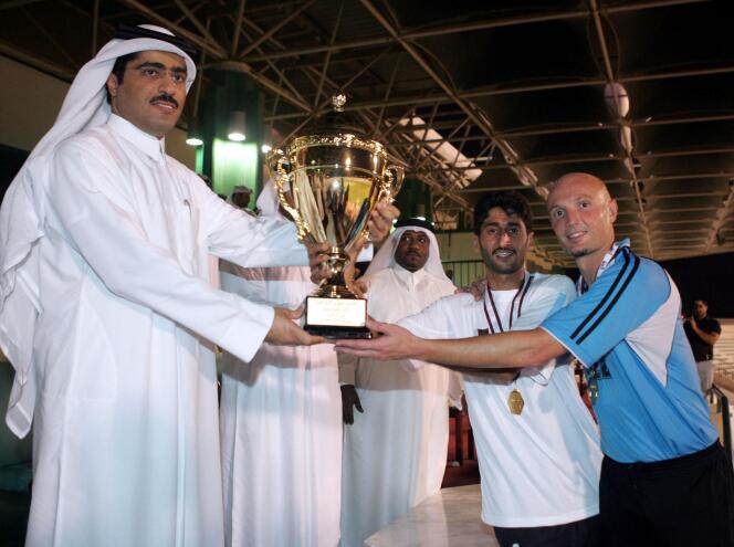 Al-Wakrah player Frank Leboeuf with Sheikh Jassem Ben Thamer Al Thani in Doha on September 17, 2004. 