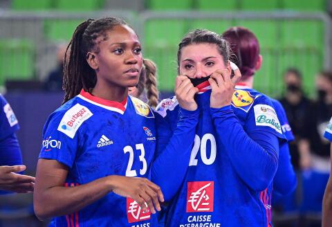 France’s field player Deborah Lassource (L) and right back Laura Flippes react after loosing the EHF Women’s European Championship semi-final handball match between Norway and France at the Arena Stozice in Ljubljana on November 18, 2022. (Photo by Jure Makovec / AFP)