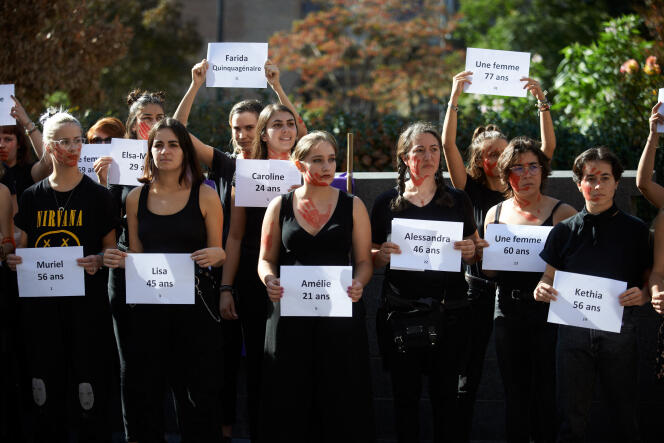 Women murdered in 2022 hold up leaflets at an event organized by the collective We All Against Feminicides in Toulouse, October 22, 2022. 