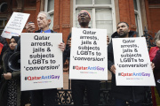 British activists protest against Qatar's crackdown on LGBT+ people, in London on November 19, 2022.