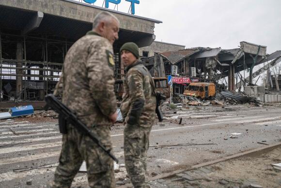 Ukrainian soldiers in front of what was Kherson International Airport in the village of Chornobaivka on November 20, 2022.