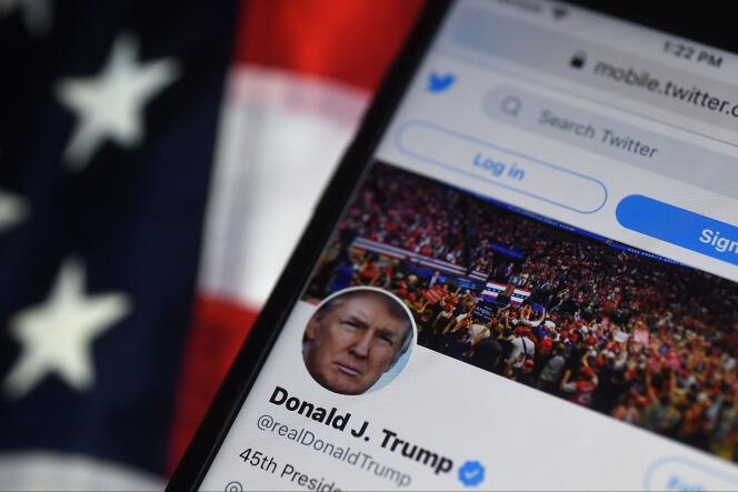 Donald Trump's twitter account seen on a cellphone screen, August 2020. Banned from the platform in early 2021, it was reactivated by app owner Elon Musk on November 19 2022.