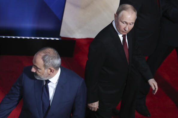 Russian President Vladimir Putin, right, and Armenian Prime Minister Nikol Pashinyan leave the podium after posing for a photo prior to a regular session of the Collective Security Council of the Collective Security Treaty Organization (CSTO) in Yerevan, Armenia, Wednesday, Nov. 23, 2022. (Vahram Baghdasaryan, Photolure via AP)