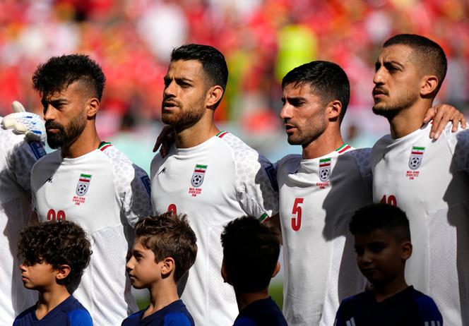 Iranian players sing their country's national anthem before the FIFA World Cup Group B match against Wales in Doha on November 25, 2022.