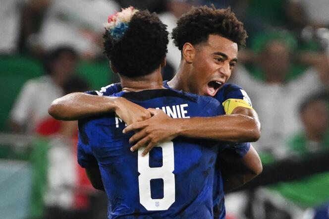 Captain Tyler Adams falls into the arms of Weston McKennie during the United States’ 1-0 victory over Iran on November 29, 2022 at Al-Thumama Stadium in Qatar.