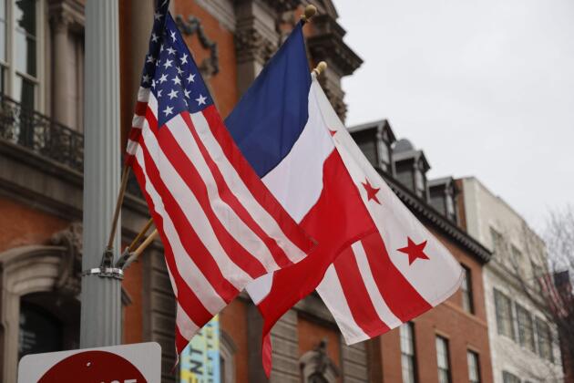 French, US and District of Columbia flags are set out for the state visit of French President Emmanuel Macron in Washington, DC, on November 29, 2022. 