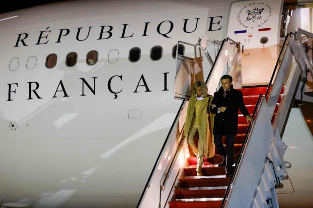 French President Emmanuel Macron and his wife Brigitte Macron disembark from their plane upon arrival at Joint Base Andrews in Maryland.