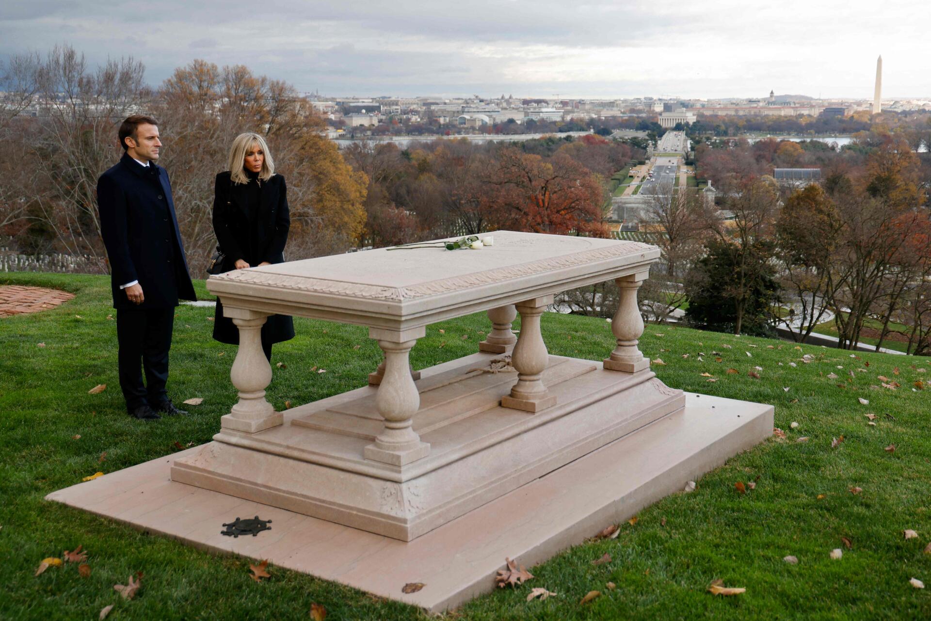 French President Emmanuel Macron and his wife Brigitte Macron visit the tomb of French-American military engineer Pierre Charles L'Enfant at Arlington National Cemetery in Arlington, Virginia.