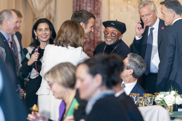 Director Spike Lee greets French President Emmanuel Macron and Speaker of the House Nancy Pelosi as they attend a state luncheon on December 1.