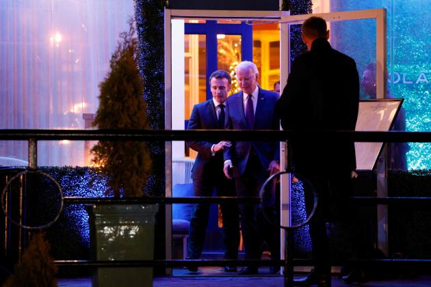 French President Emmanuel Macron chats with US President Joe Biden as they leave Fiola Mare restaurant.