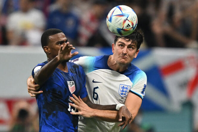 USA striker Haji Wright (left) battles for the ball with England defender Harry Maguire, during the England v USA match (Group B) of the Qatar 2022 World Cup, at Al-Bayt Stadium in Al Khor , north of Doha, on November 25, 2022.