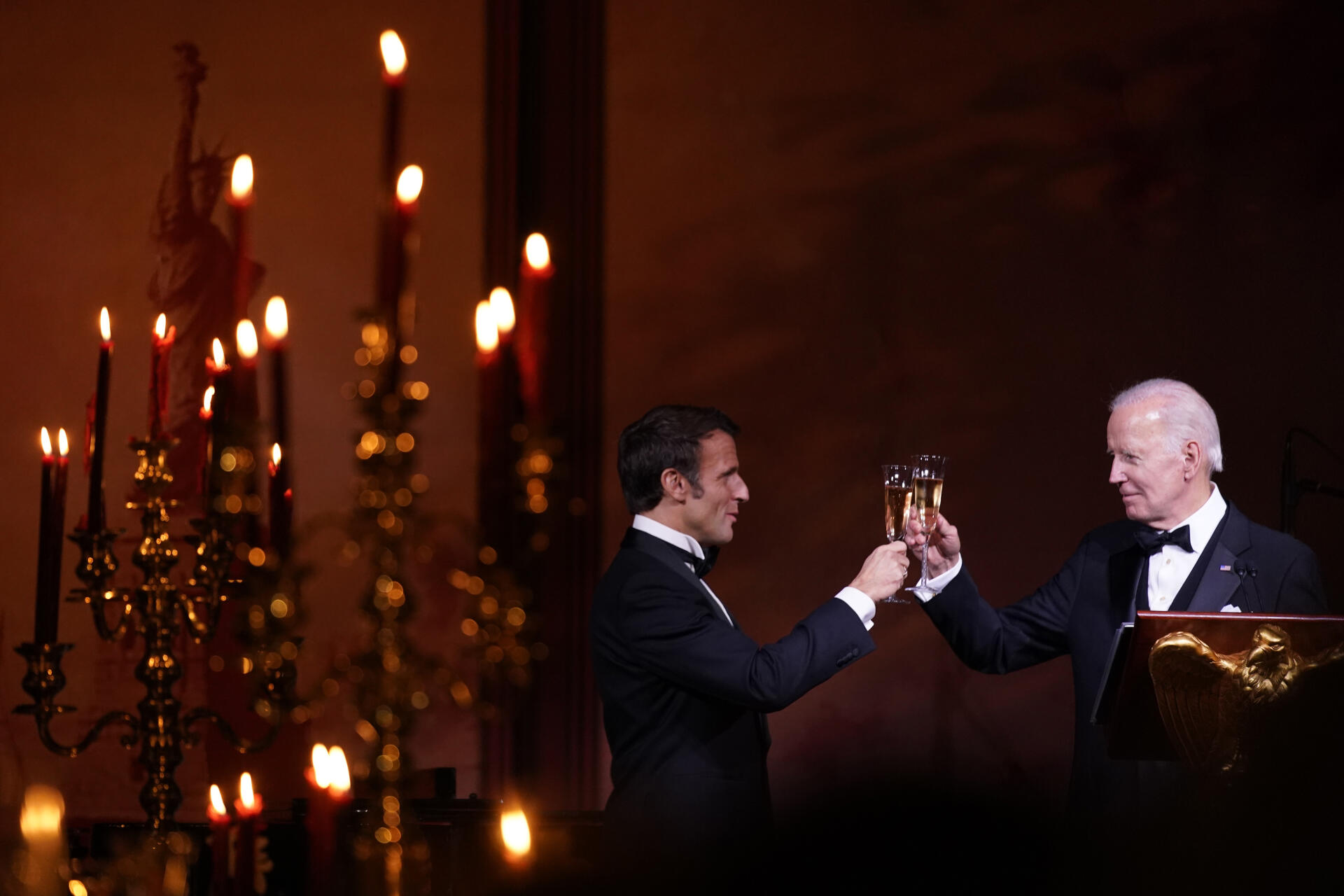President Joe Biden and French President Emmanuel Macron toast during a State Dinner on the South Lawn of the White House on Thursday.
