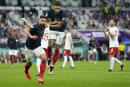 France's Olivier Giroud, left, celebrates with France's Kylian Mbappe, after scoring the opening goal during the World Cup round of 16 soccer match between France and Poland, at the Al Thumama Stadium in Doha, Qatar, Sunday, Dec. 4, 2022. (AP Photo/Ebrahim Noroozi)