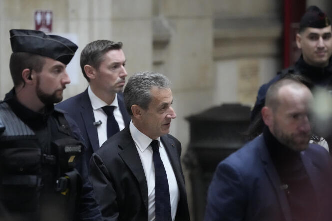 L’ancien président de la République Nicolas Sarkozy, à son arrivée au tribunal de Paris pour le procès en appel de « l’affaire des écoutes ».