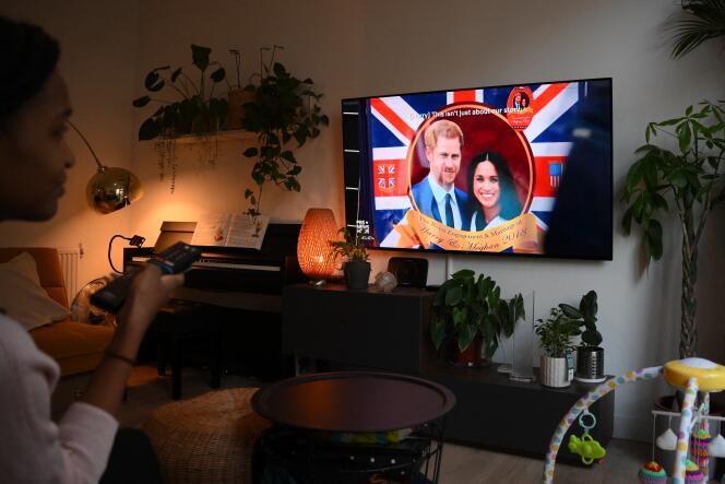 A London woman watches the documentary series 'Harry & Meghan' on December 8, 2022.