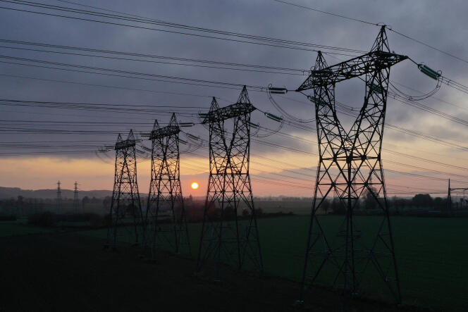 High voltage power lines in Saint-Laurent-de-Terregatte, in Normandy, on December 6, 2022.  