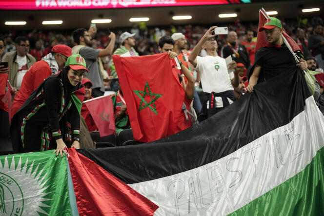 Moroccan supporters hang a Palestinian flag on the bleachers of Al-Bayt in Al-Ghor (Qatar), Wednesday, December 14, 2022, before the FIFA World Cup semi-final match between France and Morocco.