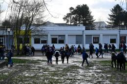 This photograph taken on February 4, 2021 shows youth in front of Georges Brassens secondary school in Le Rheu, a suburb of Rennes, western France. - Rheu's secondary school, designed without barriers, to give the pupils a sense of responsibility, will soon be fenced for safety reasons, putting an end to a 50-year-old ideal. (Photo by Damien MEYER / AFP)
