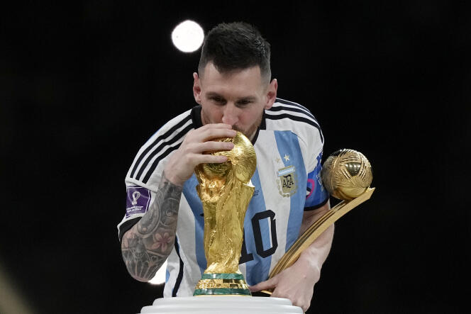 Messi posing with a vintage Louis Vuitton 1998 World Cup ball for