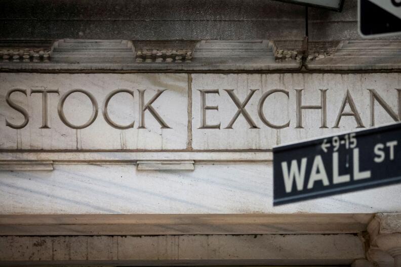 FILE PHOTO: The Wall Street entrance to the New York Stock Exchange (NYSE) is seen in New York City, U.S., November 15, 2022. REUTERS/Brendan McDermid//File Photo