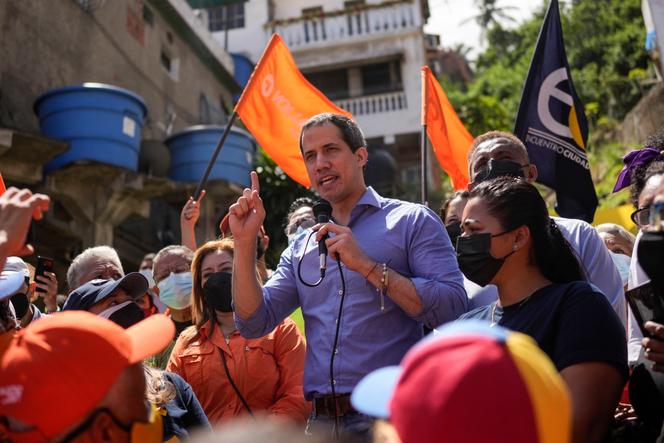 Venezuela opposition leader Juan Guaidó speaks to residents to present his unity plan to Venezuelans in Maiquetia, Venezuela, February 19, 2022.