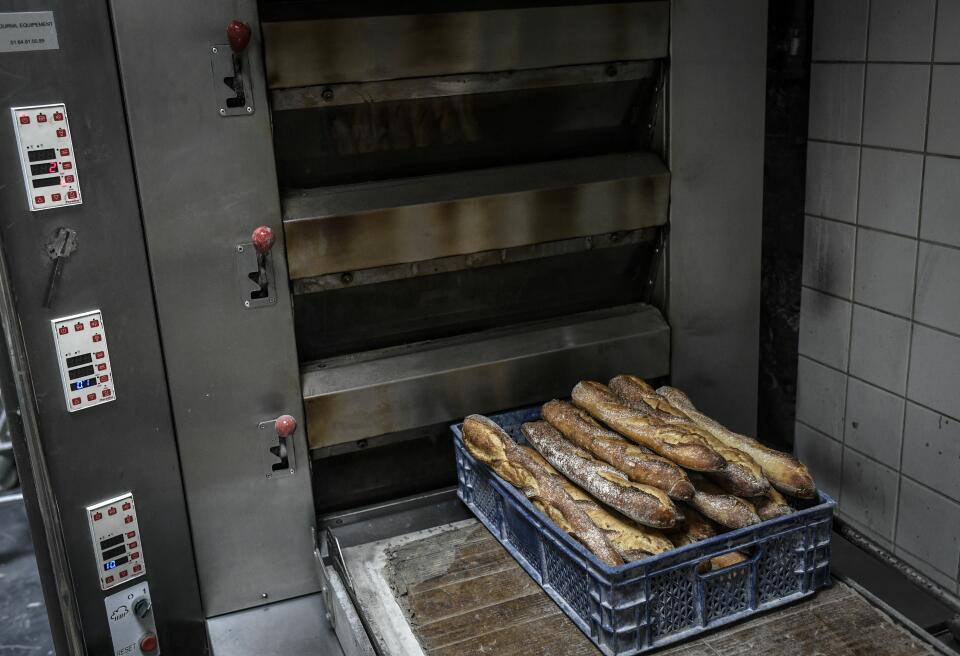 This photograph taken on November 15, 2022 shows breads displayed at the organic Racynes bakery in Boulogne-Billancourt, outside Paris. (Photo by STEPHANE DE SAKUTIN / AFP)
