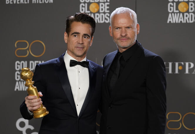 Colin Farrell, Best Actor in a Comedy for 'The Banshees of Inisherin,' and Martin McDonagh, Best Screenplay and Best Comedy for the motion picture, at the conclusion of the Golden Globes ceremony in Beverly Hills, California, on 10 January 2023. 