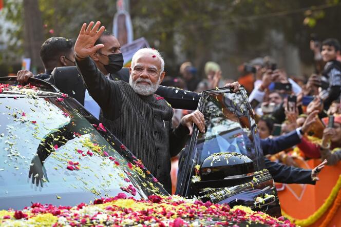 Narendra Modi greets his supporters in New Delhi on January 16, 2023.