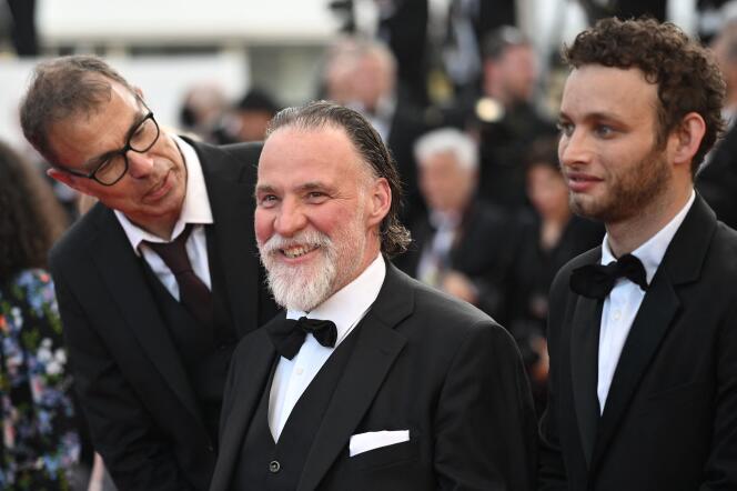 From left to right: director Dominik Moll, actors Bouli Lanners and Théo Cholbi during the screening of the film “La Nuit du 12” at the 75th Cannes Film Festival, May 20, 2022. 