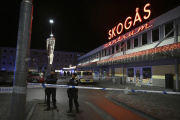 Police at the scene where a teenager was shot dead in Skogas, south of Stockholm, on January 28.