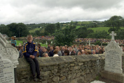 A crowd attends the funeral of the three boys killed in the Omagh bombing at St. Mary's Church in Buncrana, Northern Ireland, August 19, 1998.