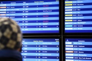 A man looks at the information board reading the different planes canceled during a strike at the Paris Orly airport in Orly, December 5, 2019.