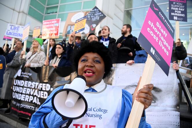 A person uses a megaphone as nurses protest during a strike by NHS medical workers on February 6, 2023.