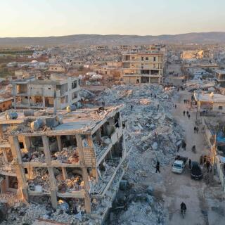 TOPSHOT - An aerial view shows the destroyed buildings in the rebel-held town of Jindayris on February 9, 2023, three days after a deadly earthquake that hit Turkey and Syria. The 7.8-magnitude quake early on February 6 has killed more than 17,000 people in Turkey and war-ravaged Syria, according to officials and medics in the two countries, flattening entire neighbourhoods. (Photo by Omar HAJ KADOUR / AFP)
