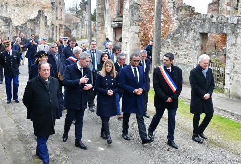 (From L) Former French President Francois Hollande, President of the national association of the families of the martyrs of Oradour-sur-Glane Benoit Sadry, French Secretary of State for Veterans and Memory Patricia Miralles, French Education and Youth Minister Pap Ndiaye, Oradour-sur-Glane's mayor and Ambassador of Germany to France and Monaco Hans Dieter Lucas walk in the street during a tribute to the last survivor of the massacre of June 10, 1944, Robert Hebras, in Oradour-sur-Glane, on February 17, 2023. (Photo by PASCAL LACHENAUD / AFP)