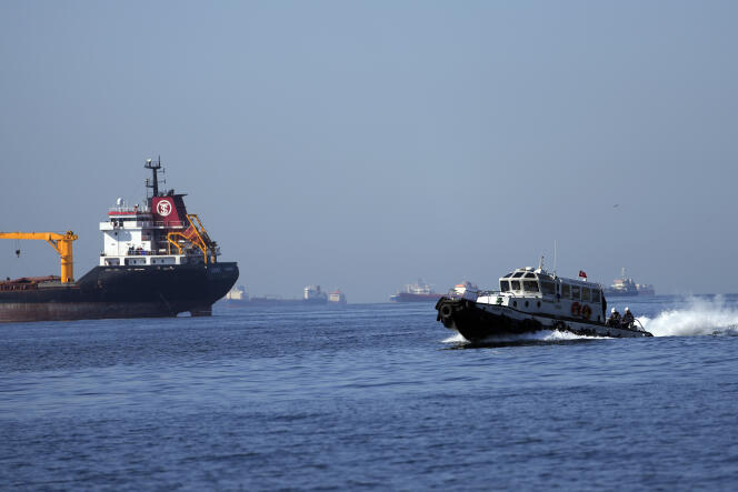 A boat with Russian, Ukrainian, Turkish and UN officials heads to inspect cargo ships coming from Ukraine loaded with grain, in the Marmara Sea in Istanbul, Turkey, Saturday, October 1, 2022. 